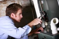 our tech Jim is doing a water heater repair in Greenbelt, MD